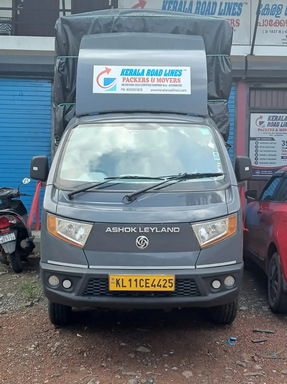 Ashok Leyland Bada Dost truck with Kerala Road Lines Packers and Movers board in Kozhikode