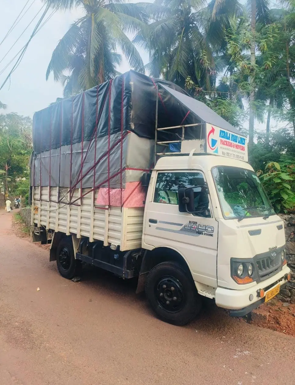 Fully loaded Kerala Road Lines truck secured for an interstate shifting trip
